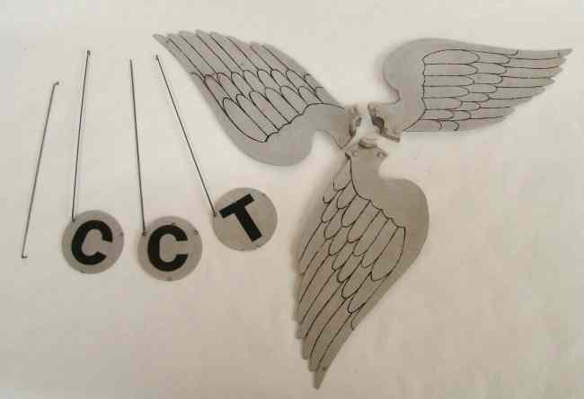 Appraisal: C T C Winged Wheel decoration for parades Mounts within