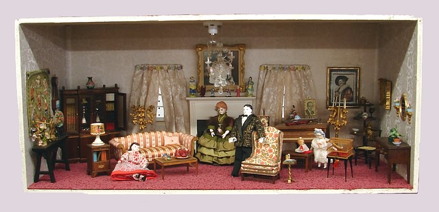 Appraisal: Diorama Victorian Parlor Bisque head w wooden body dollhouse dolls