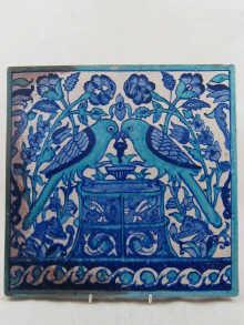 Appraisal: A square ceramic tile in blue and green of two