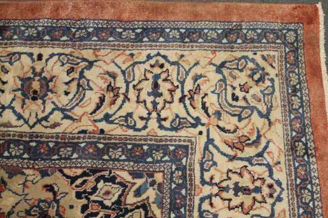 Appraisal: A LARGE PERSIAN MAHAL TYPE CARPET of pale red ground