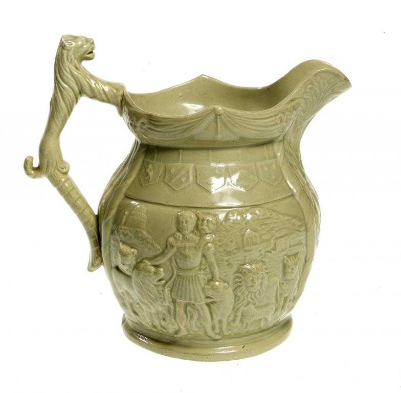 Appraisal: AN UNUSUAL STAFFORDSHIRE DRABWARE LION TAMER JUG with lion handle