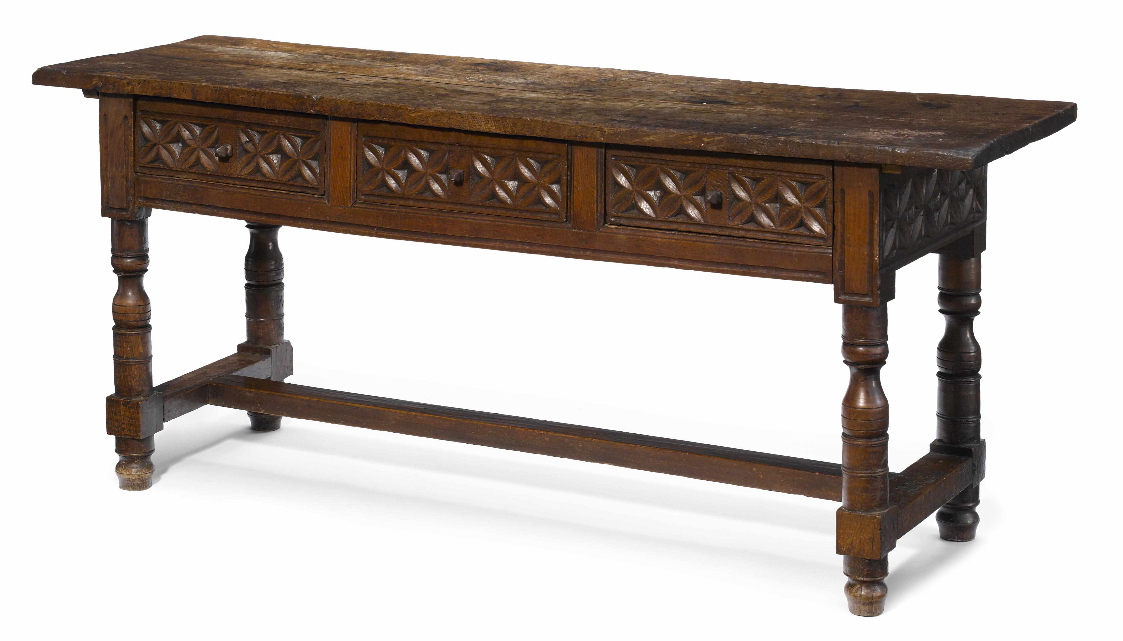 Appraisal: A Spanish Baroque carved oak library table incorporating antique and