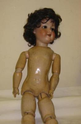 Appraisal: An Armand Marseille bisque head girl Mamma doll with brown