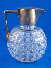 Appraisal: A silver mounted hobnail cut glass claret jug in the