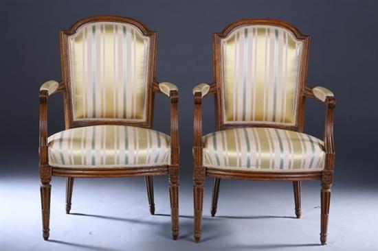 Appraisal: PAIR LOUIS XVI PROVINCIAL CARVED FRUITWOOD FAUTEUILS late th century