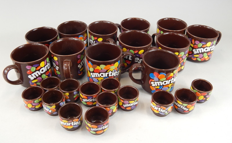 Appraisal: A quantity of Hornsea pottery novelty Smarties mugs and egg