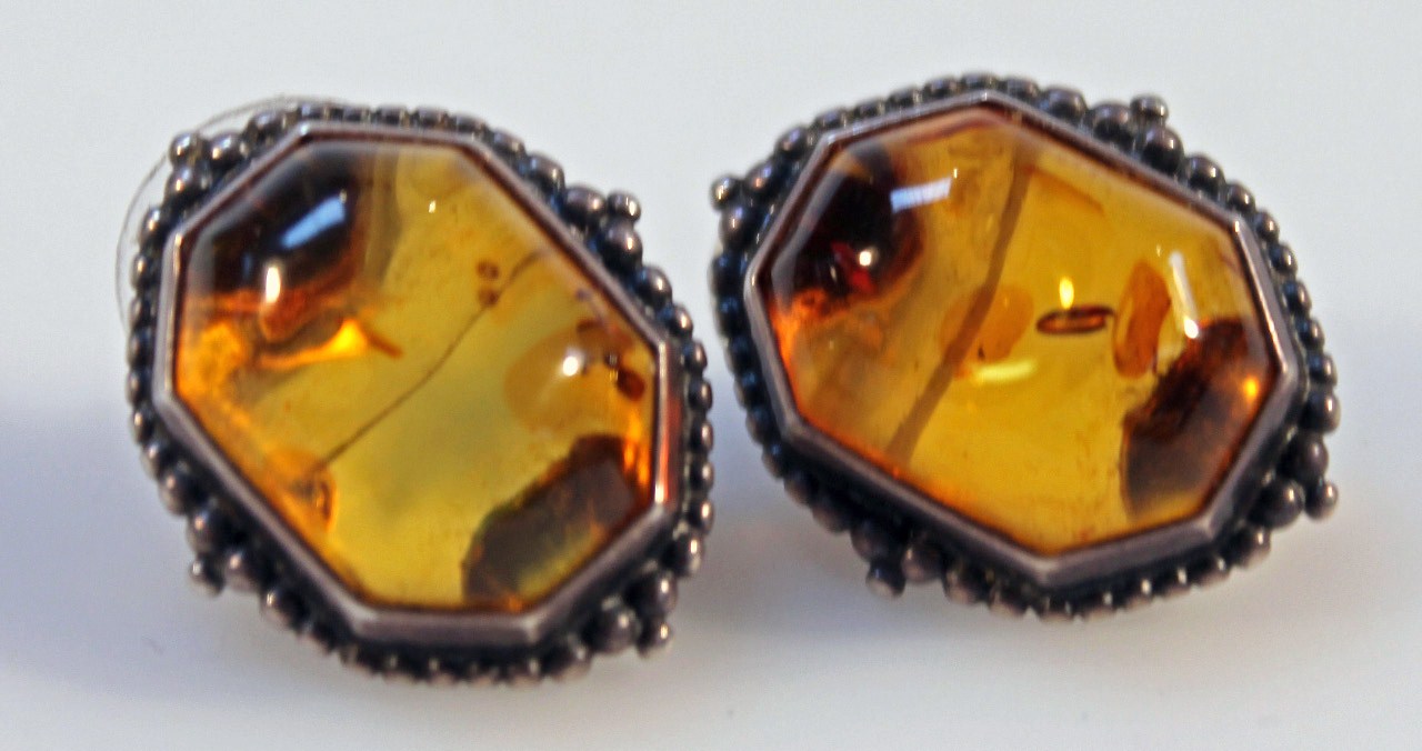 Appraisal: A pair of Baltic amber earrings in mounts white metal