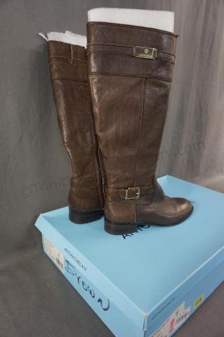 Appraisal: Features dark brown high rise riding style boot with a