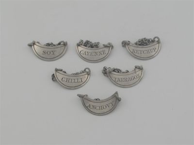 Appraisal: A set of six crescent shaped sauce labels with single