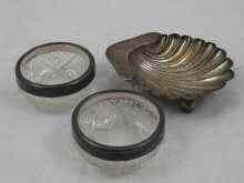 Appraisal: A silver butter shell London and a pair of silver