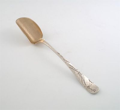 Appraisal: An American serving scoop with a hammered finish and a