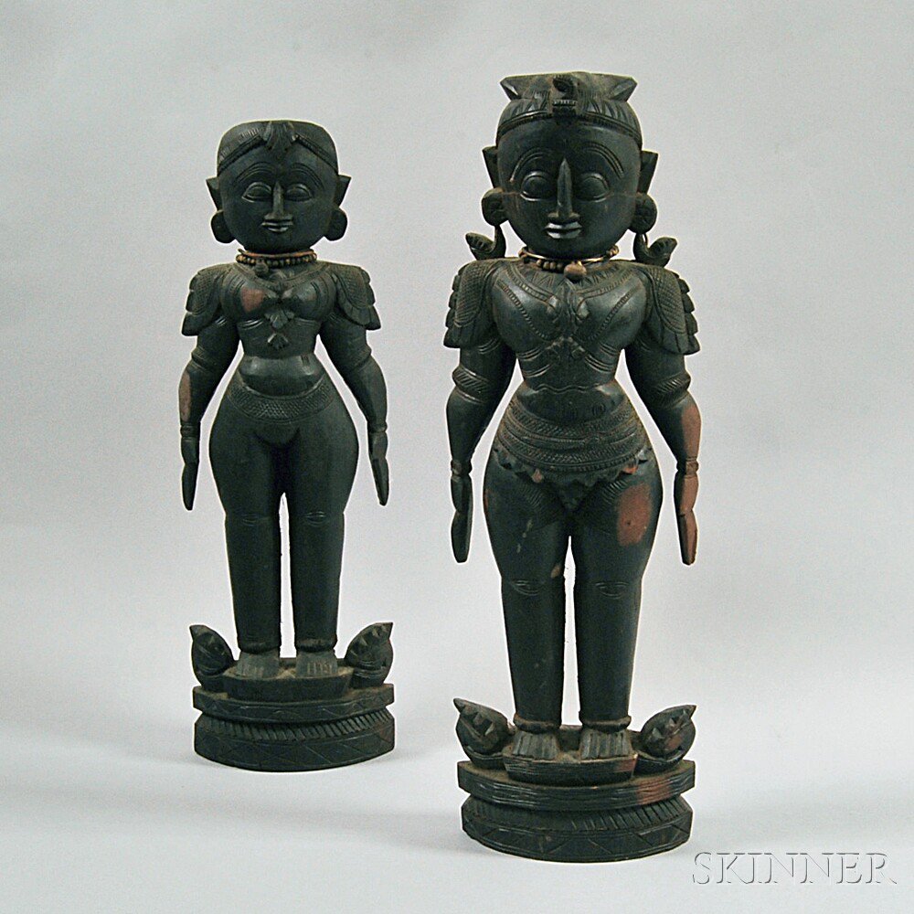 Appraisal: Two Indian Wood Carvings stylized male and female standing figures