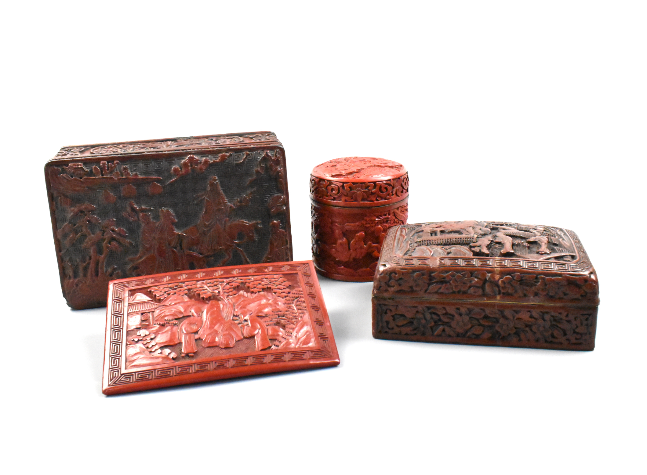 Appraisal: Four Chinese cinnabar carved boxes with covers and one carved