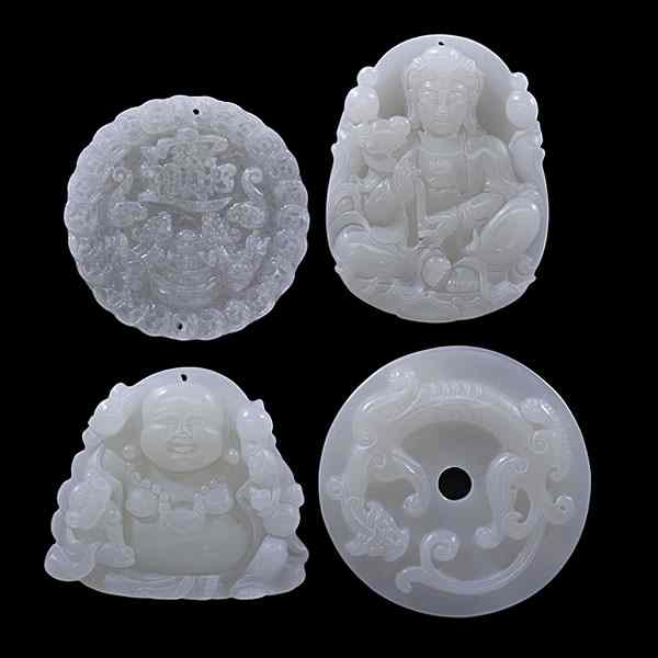 Appraisal: Chinese White Jade Pendants Chinese th century Four white jade