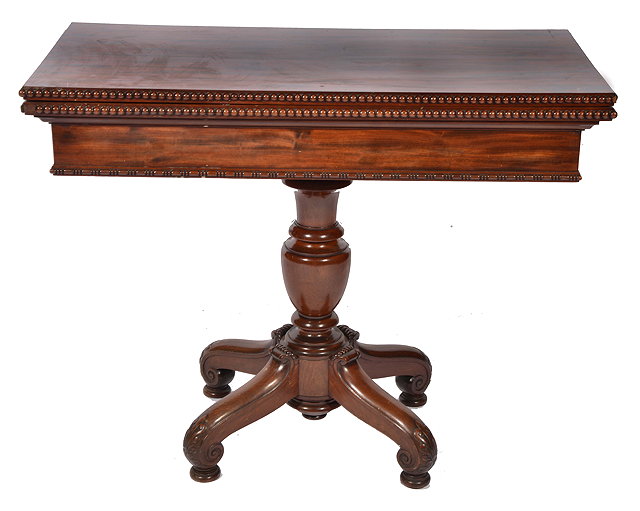 Appraisal: A TH CENTURY MAHOGANY FOLDOVER CARD TABLE with beaded edge