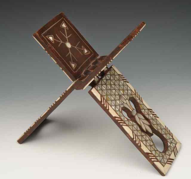 Appraisal: A PERSIAN QUR'AN STAND with geometric mother of pearl inlay