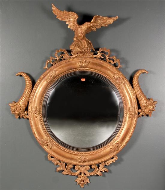 Appraisal: Regency style giltwood eagle convex mirror th century in H