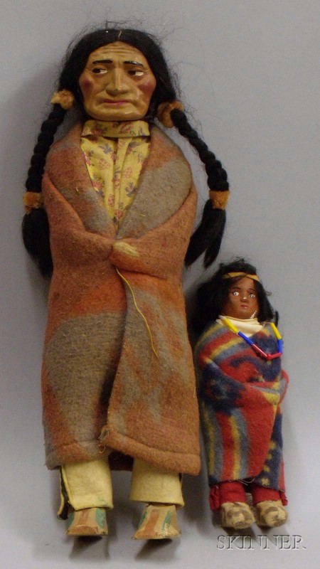 Appraisal: Two Skookum Indian Dolls early th century brave with molded