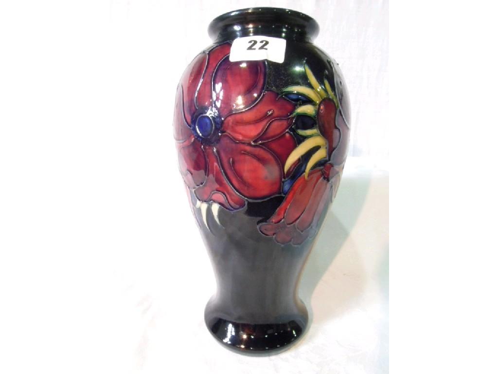 Appraisal: A blue ground Moorcroft vase of baluster shaped form with