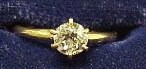 Appraisal: JEWELRY K yellow gold diamond ring set with one round