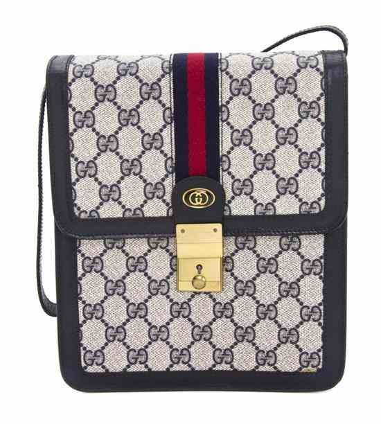 Appraisal: A Gucci Navy Monogram Canvas Messenger Bag s with goldtone