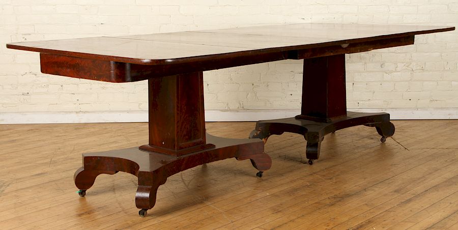 Appraisal: A TWO PART EMPIRE MAHOGANY DINING TABLE C A two