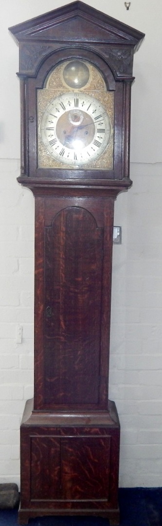 Appraisal: A George III oak longcase clock with arched and pillared