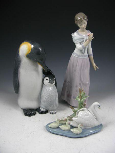 Appraisal: Three Porcelain Figures Lladro lady in Lladro swan and duckling