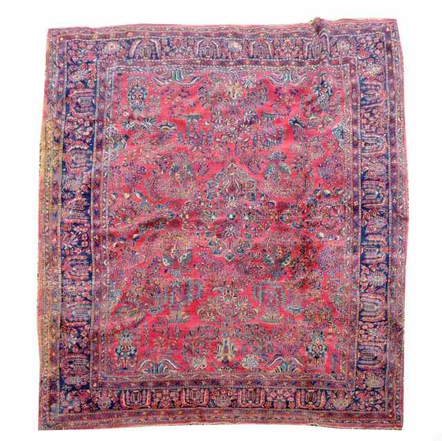 Appraisal: AN ANTIQUE PERSIAN BLUE GROUND CARPET decorated a continuing pattern