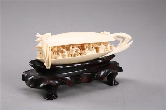 Appraisal: CARVED IVORY SHELL Chinese landscape inside a large carved shell