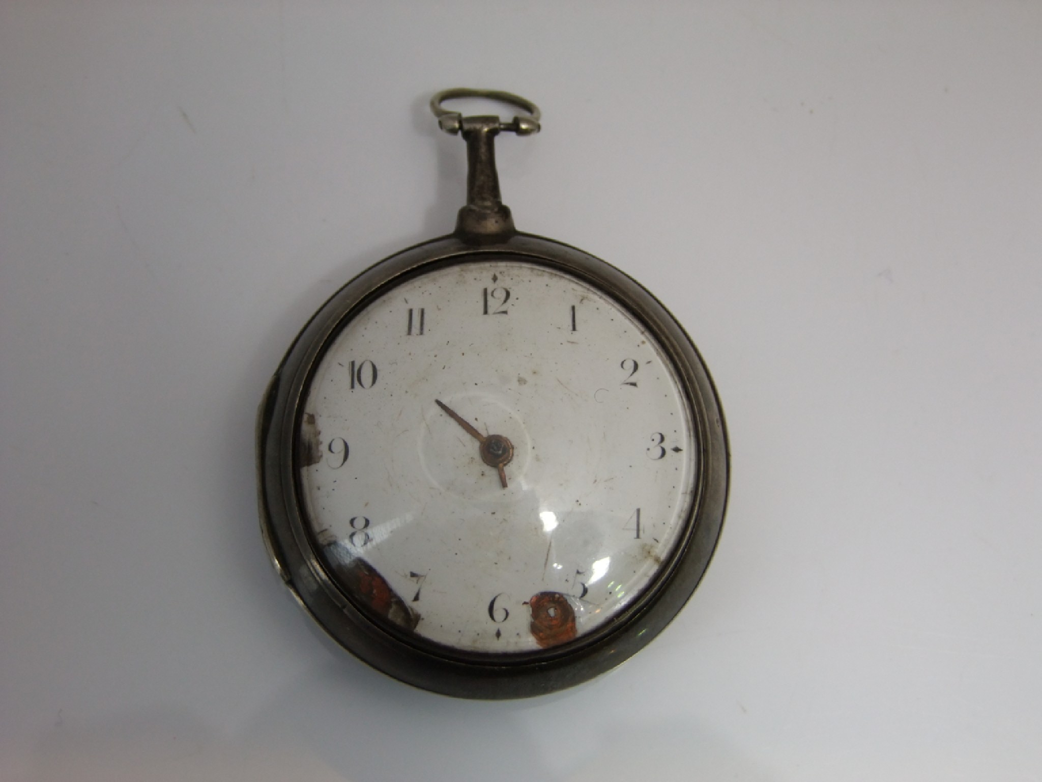 Appraisal: A Georgian silver pair-cased pocket watch the white enamelled dial