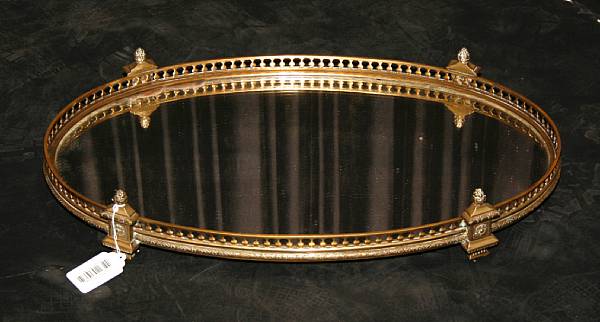 Appraisal: A Louis XVI style cast brass mirror plateau early th