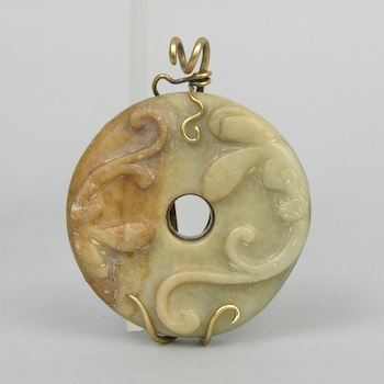 Appraisal: A Carved Jade Disc with Salamanders A lovely archaistic carved