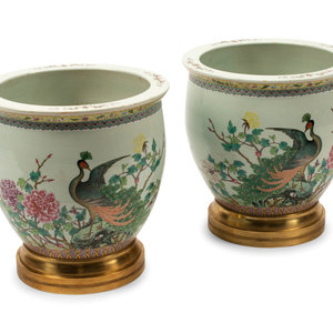 Appraisal: A Pair of Chinese Porcelain Jardinieres with Gilt Bronze Bases