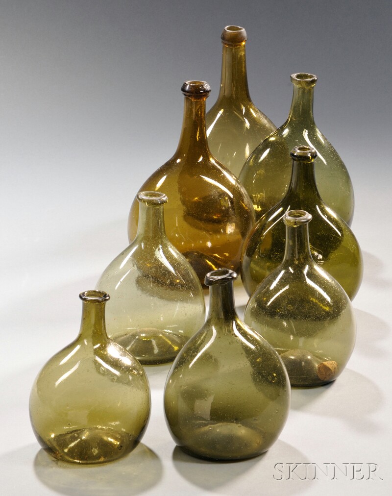 Appraisal: Eight Free-blown Glass Chestnut Bottles probably New England - olive