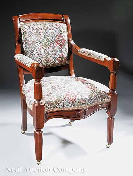 Appraisal: An American Late Classical Walnut Armchair c molded crest rail