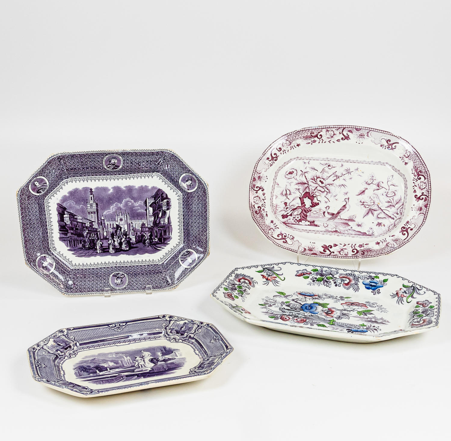 Appraisal: FOUR ENGLISH PURPLE TRANSFER-DECORATED IRONSTONE PLATTERS late th century lg