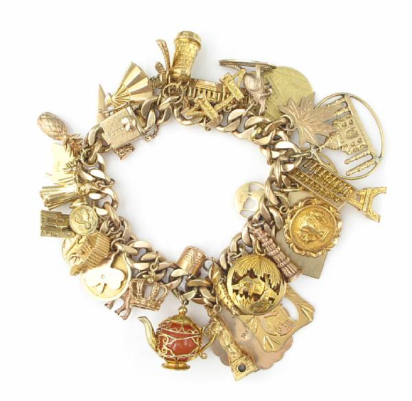 Appraisal: A gold charm bracelet with numerous charms grams gross