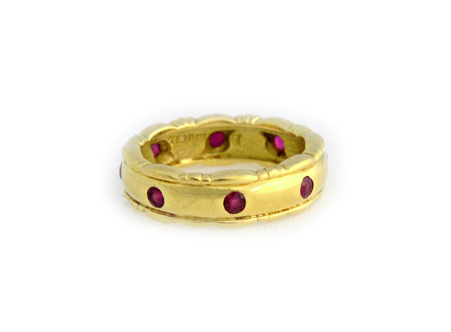 Appraisal: A Theo Fennell ct gold and ruby set eternity ring