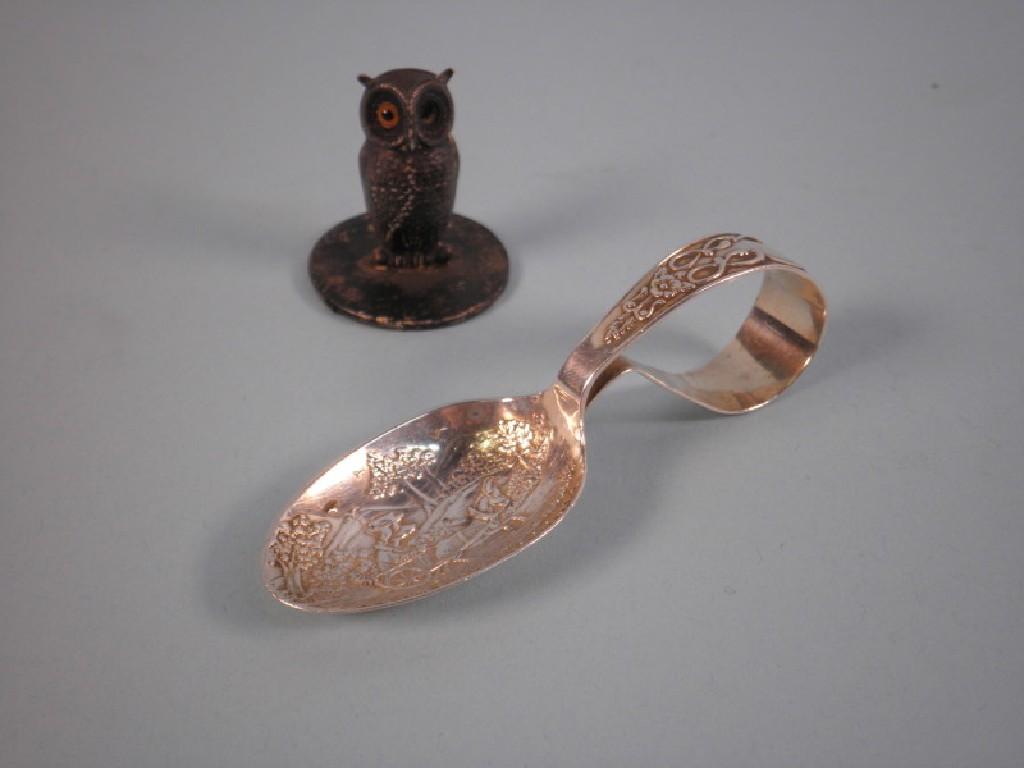 Appraisal: A Victorian silver caddy spoon with fold over handle cast