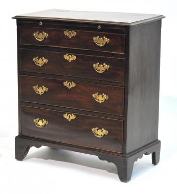 Appraisal: A SMALL MAHOGANY CHEST with brushing slide moulded edged top