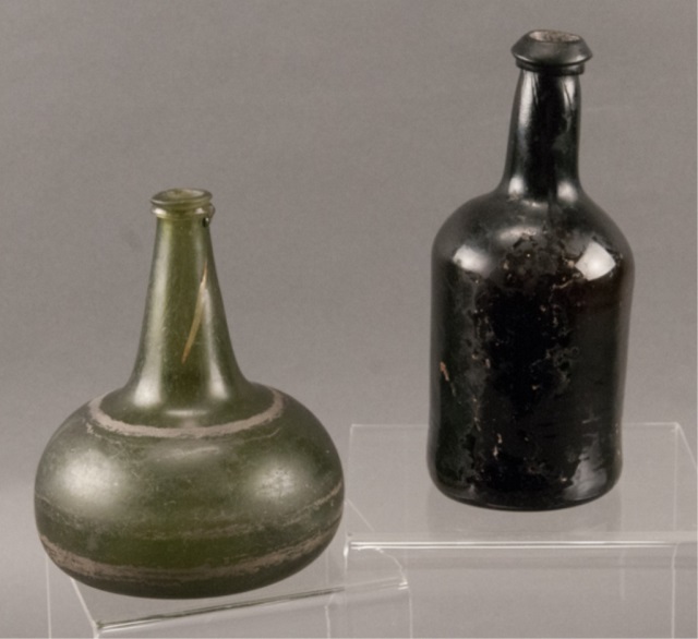 Appraisal: Two th Century Blown Glass Bottles One olive green squat