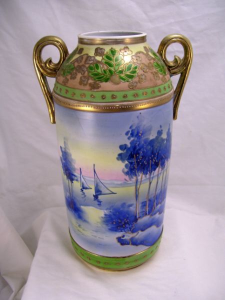 Appraisal: Nippon Porcelain Vase Double swirl handles raised gold decoration with