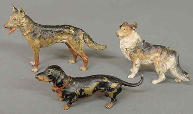 Appraisal: Three Vienna bronze cold painted dogs late th c shepherd