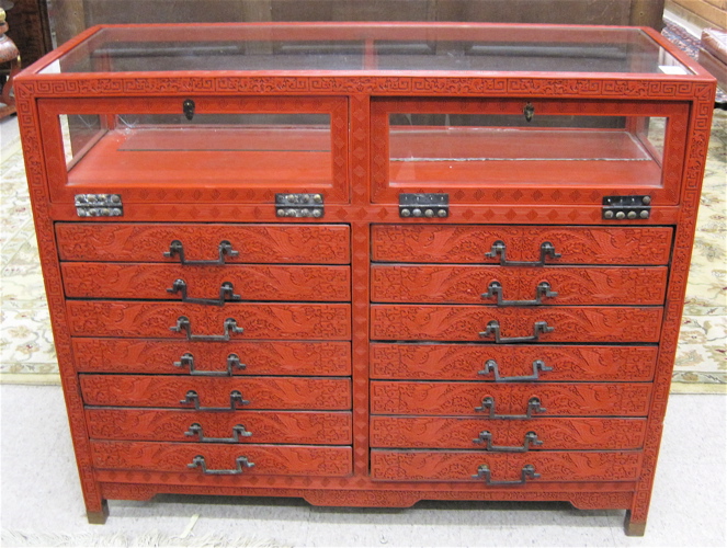 Appraisal: CHINESE RED CINNABAR DISPLAY CASE CHEST having a rectangular glass-paneled