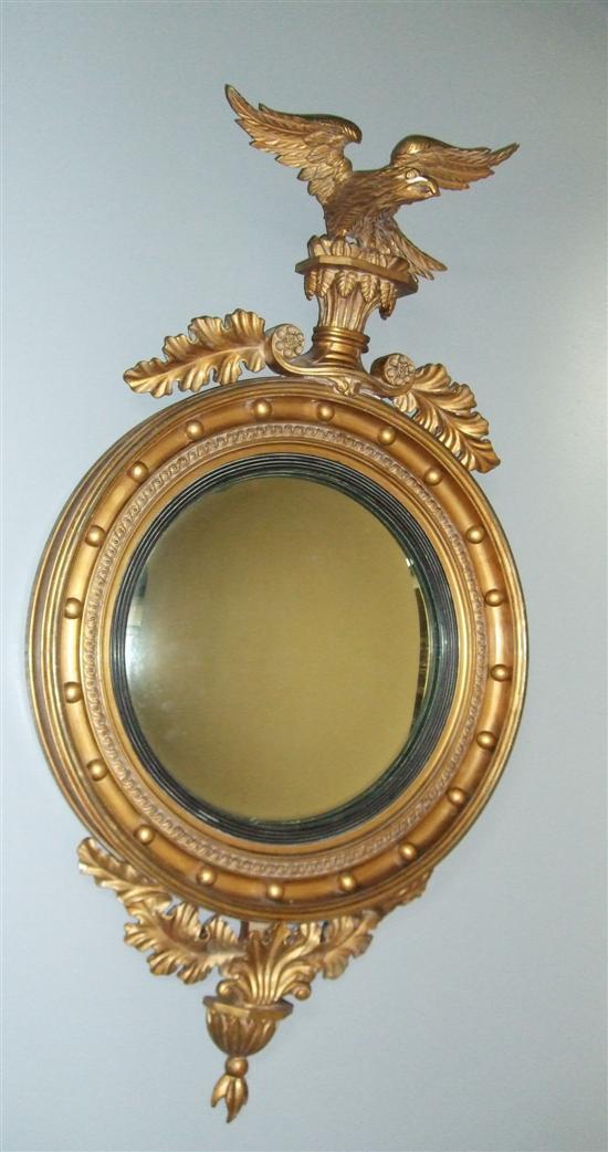 Appraisal: Gilt framed circular convex wall mirror th century with eagle