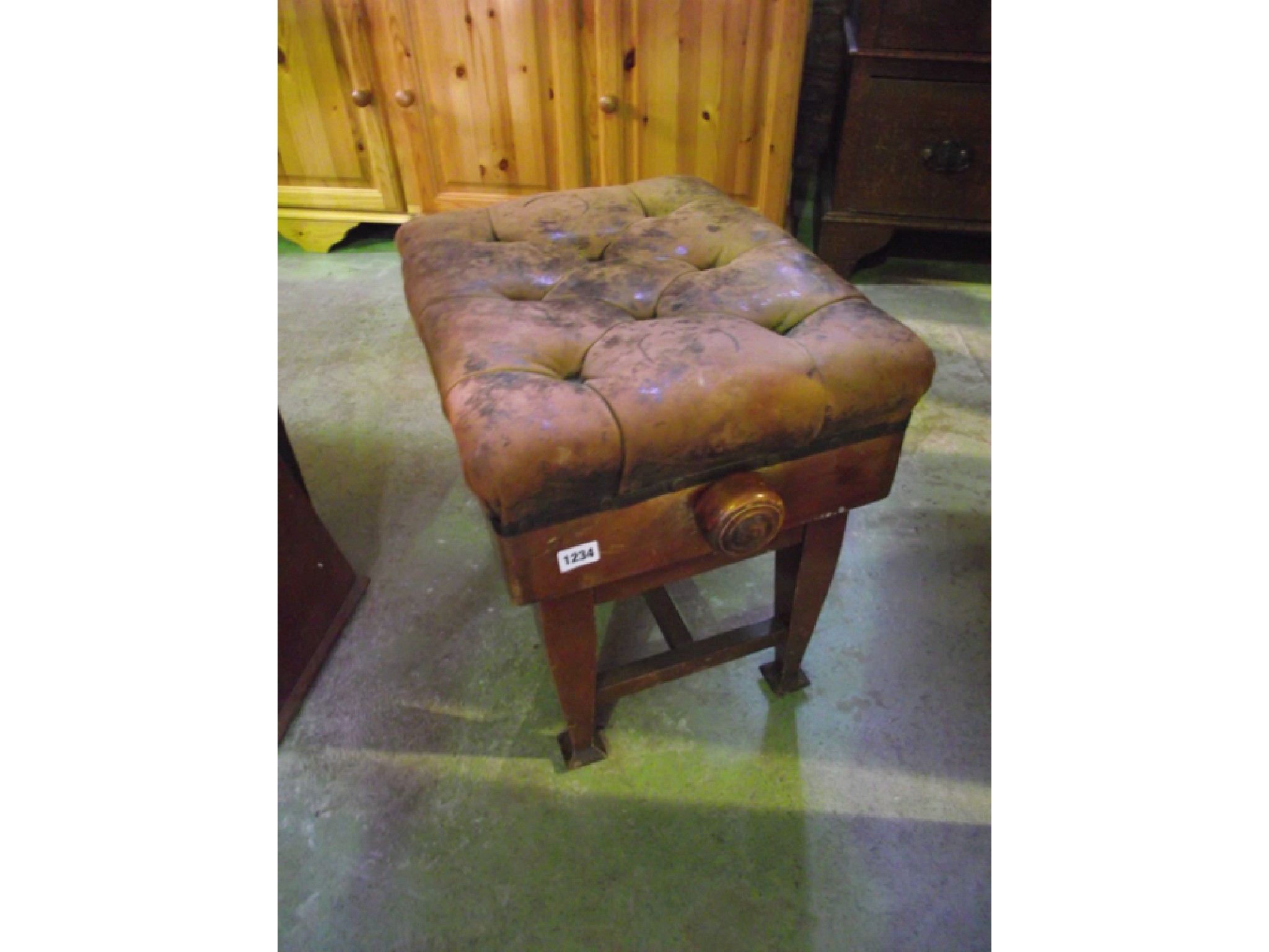 Appraisal: An Edwardian piano stool with buttoned hide upholstered seat raised