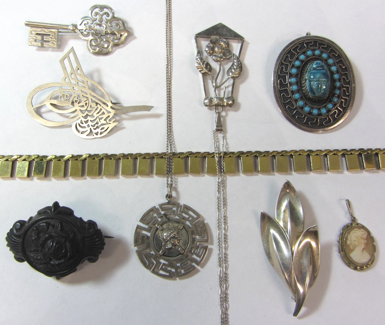 Appraisal: A small group of jewellery comprising five brooches a gilt