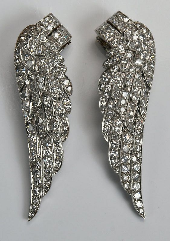 Appraisal: Platinum Gold and Diamond Earclips wing design each with single