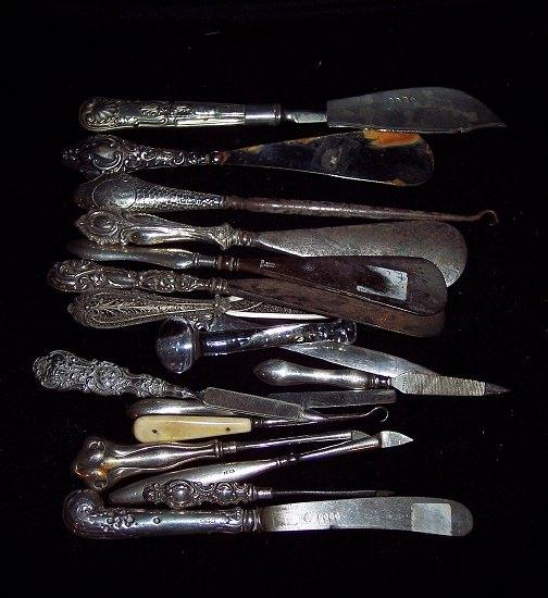 Appraisal: A quantity of silver handled shoe horns button hooks etc